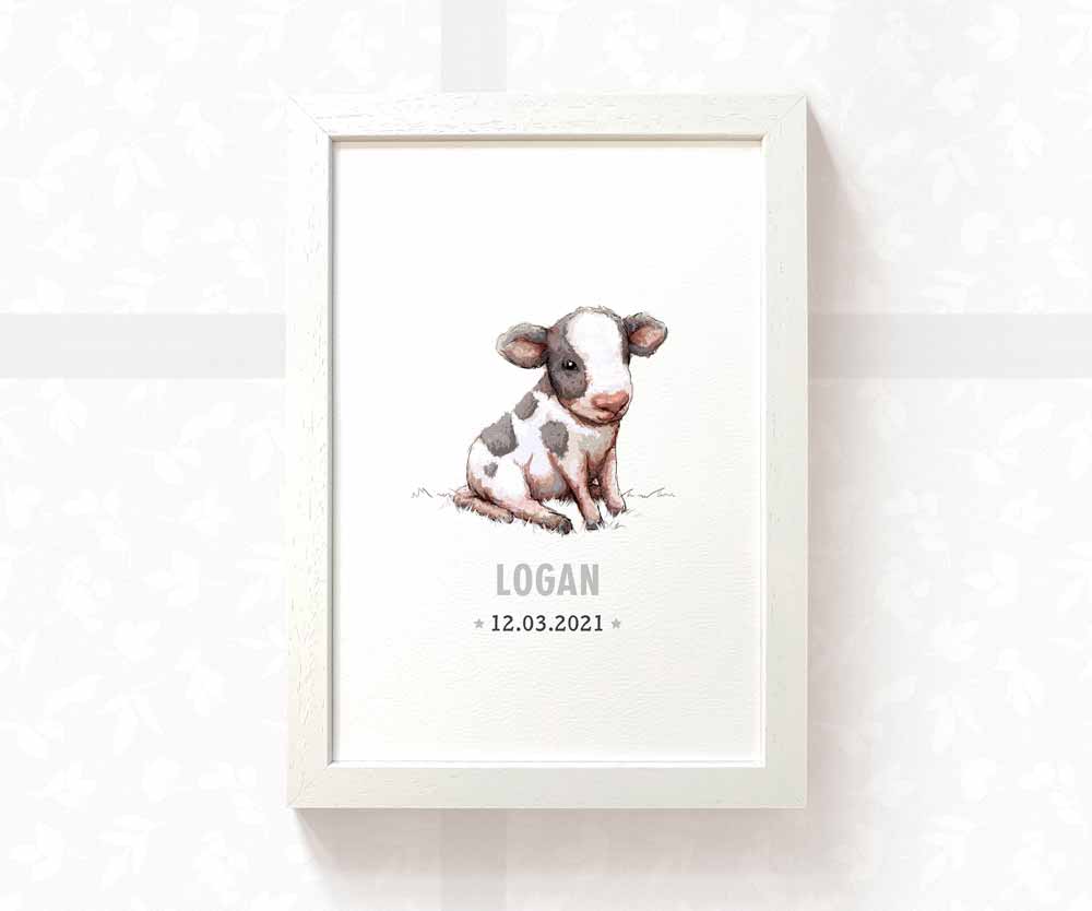 Personalised cow nursery art print with baby name and date of birth displayed in a white frame