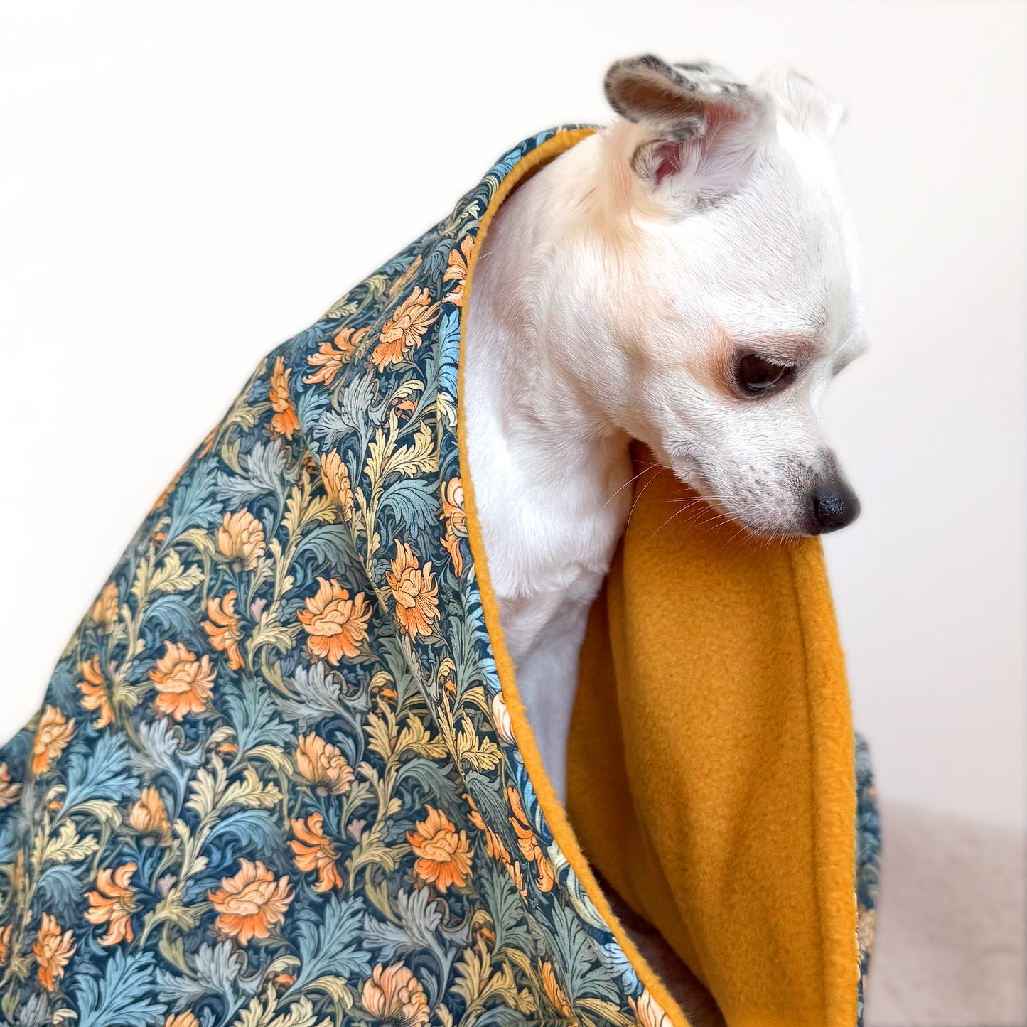 Handmade dog blanket with patterned cotton top and ochre fleece lining for small, medium and large dogs