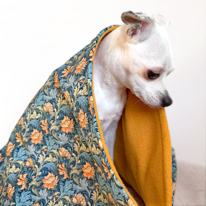 Handmade dog blanket with patterned cotton top and ochre fleece lining for small, medium and large dogs