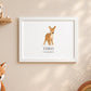 A framed personalized animal print featuring a watercolor fawn with the name 'THEO' and date '03.09.