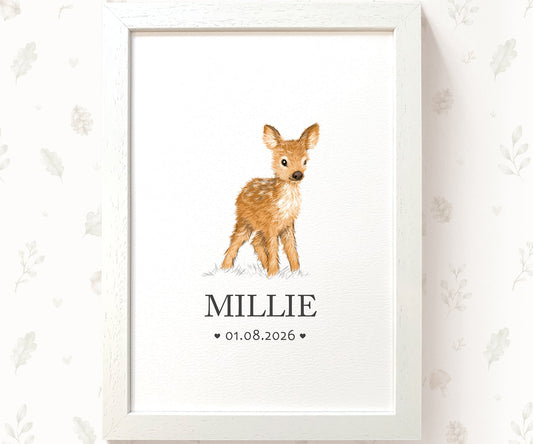 A framed personalized baby print featuring a watercolor illustration of a fawn with the name 'MILLIE' and the date '01.08.