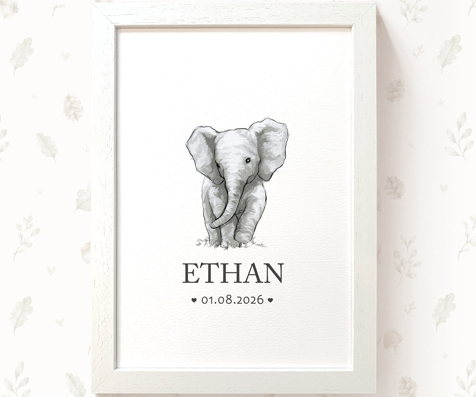 A framed personalized baby elephant art print featuring a black and white sketch of a baby elephant with the name 'ETHAN' and date '01.08.