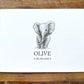 A personalized baby shower card featuring a hand-drawn gray elephant illustration and the name 'OLIVE' with the date '06.08.