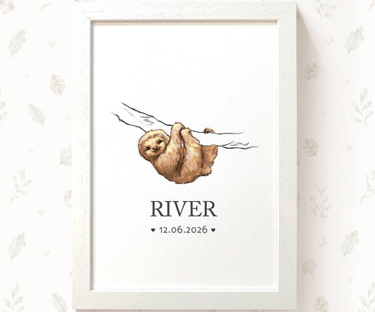 A framed personalized art print featuring a watercolor illustration of a sloth hanging from a branch, with the name 'RIVER' and the date '12.06.