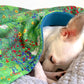 Dog sleeping under handmade floral cotton and fleece dog blanket